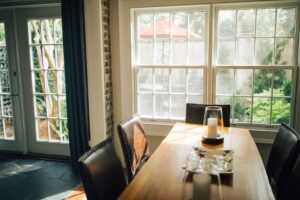Double-hung windows with grille patterns in home dining room